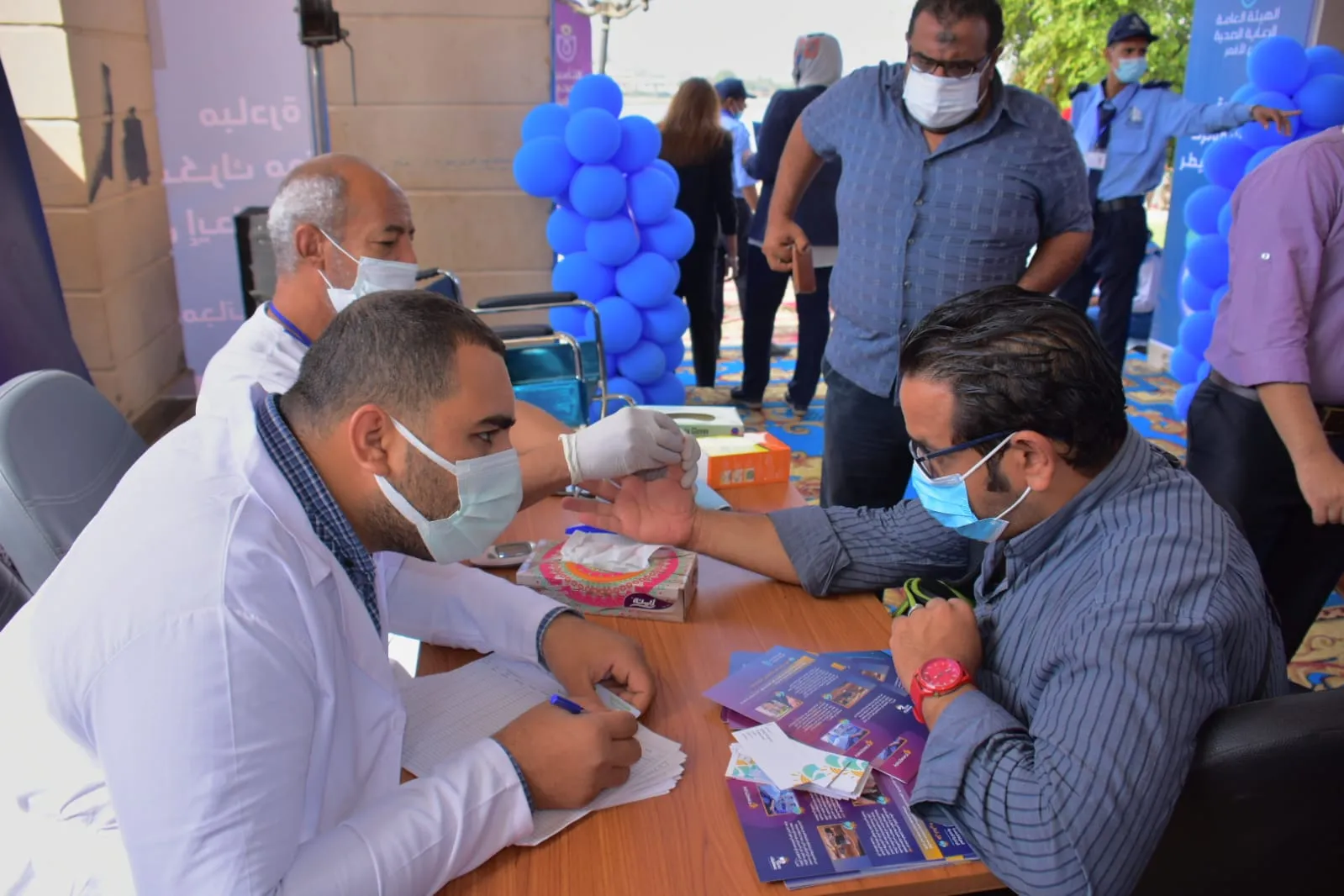 جانب من حملات التأمين الصحي الشامل 