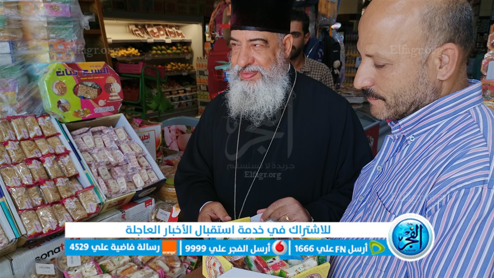 القمص يوانس أديب يوزع حلوي المولد النبوي الشريف