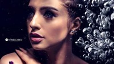 خبيرة تجميل تعقد جلسة تصوير رائعة تحت الماء (صور)