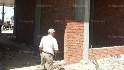 وقف أعمال مباني مخالفة بمحطة وقود بطريق 