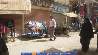 رفع الإشغالات لتحقيق السيولة المرورية بمركز سنورس بالفيوم 