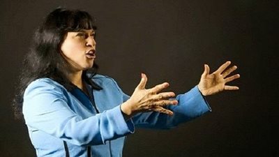 603 كلمة فى 54.5 ثانية جعلت امرأة تسجل  بـ 