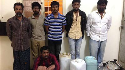 الإطاحة بعمالة آسيوية تصنع وتروج الخمور داخل مسكنهم ببلقرن