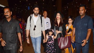 إيشواريا و أبهيشك باتشان يعودان من دبي برفقة ابنتهم (صور)