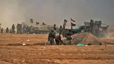 الحشد الشعبى يتهم أمريكا بإمداد داعش بأسلحة كبماوية