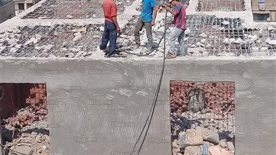 المرافق تزيل الإشغالات والمباني المخالفة بالجيزة (صور)