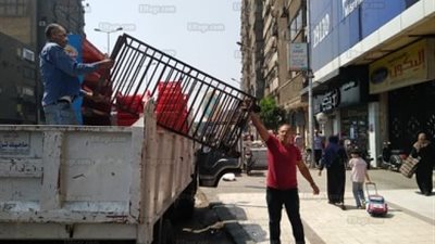 شرطة المرافق تزيل الإشغالات بحي الدقي (صور)