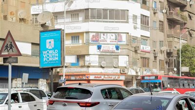 لافتات منتدى شباب العالم تزين شوارع الدقي (صور)