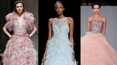 للعروس.. تشكيلة فساتين خطوبة 2019 مزينة بالريش (صور)