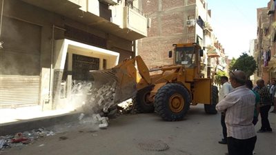 حملة تحصيل مستحقات الدولة بحى الاربعين فى السويس 