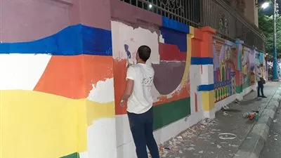 طلاب جامعة الفيوم يجملون شوارع وميادين المحافظة (صور)