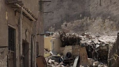 إخلاء عقار بحي الخليفة بعد انهياره جزئيا (صور)