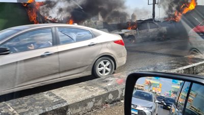 إخماد حريق التهم سيارة ملاكى أعلى كوبرى اكتوبر  (صور)