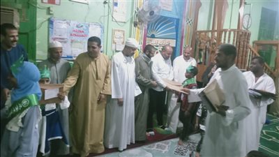 تكريم المتميزين من حفظة القرآن الكريم بقرية أبومناع في دشنا