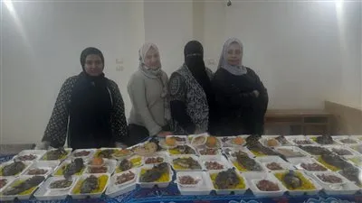سيدات أسيوط يجهزن 300 وجبة إفطار سمك للصائمين